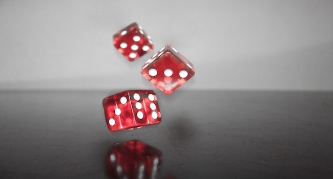 Dice falling onto a table, mid game